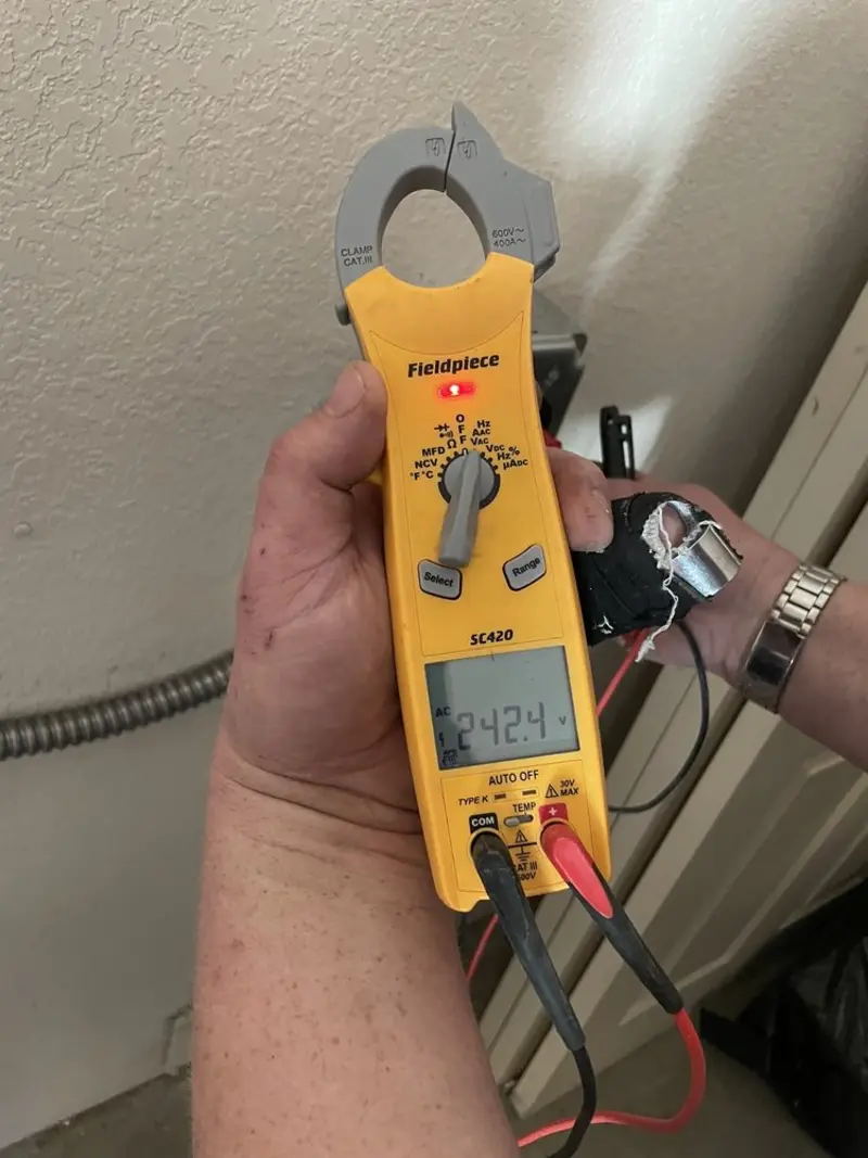 Voltage testing with clamp meter during Recessed Lighting Installation in Richland